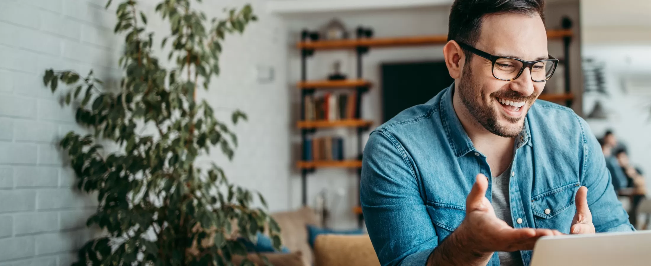 Man with beard and glasses on a Telehealth call