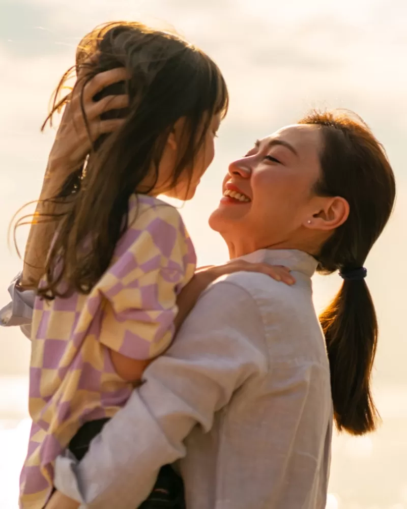 Mother and child playing outside