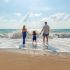 Parenting Ideas Summer Holidays Parents with Child at the beach